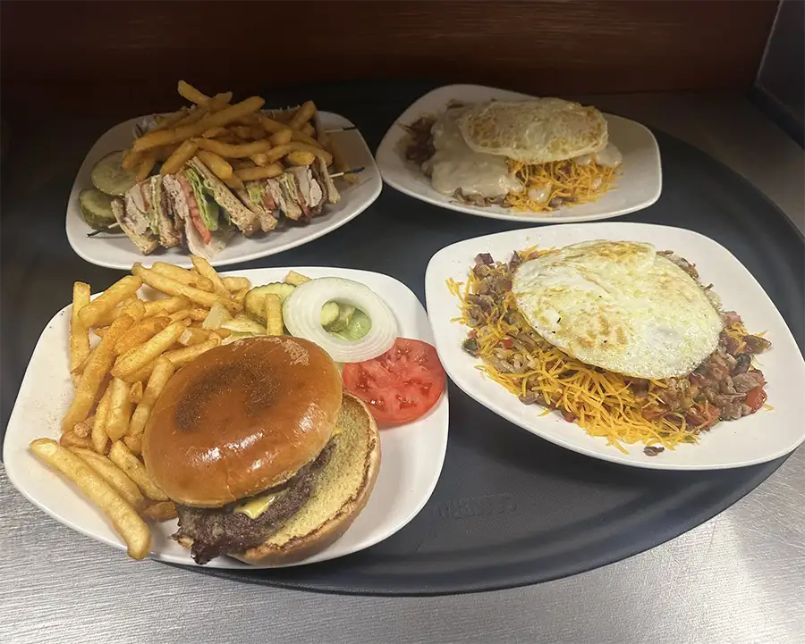 Sunrise Cafe in Decatur, IL - tray of four plates of different food from the breakfast and lunch menu